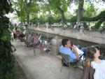 Parisians relaxing on Sunday afternoon around the Medici Fountain, Jardin de Luxembourg.