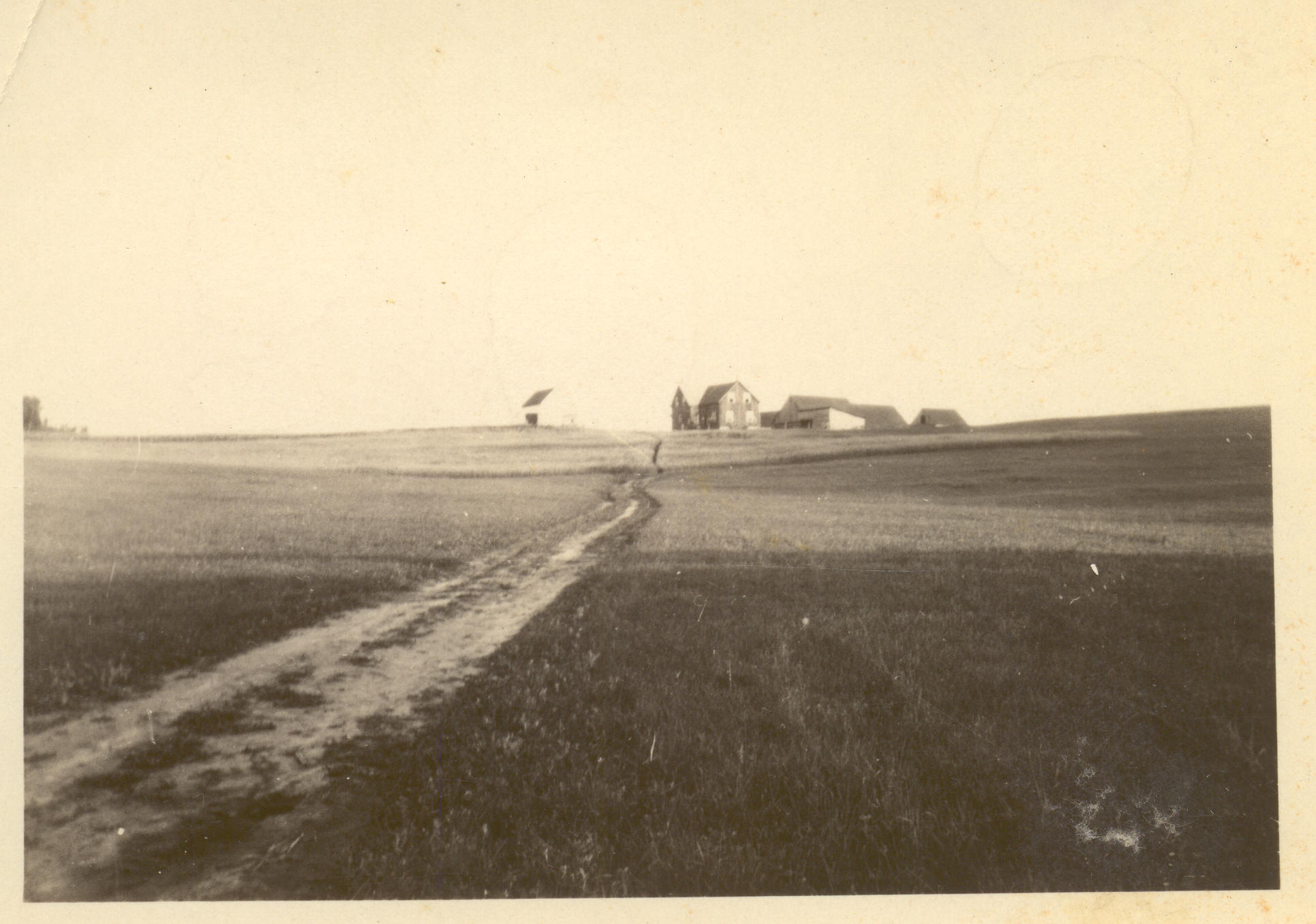 1930s:  Farm on hill.