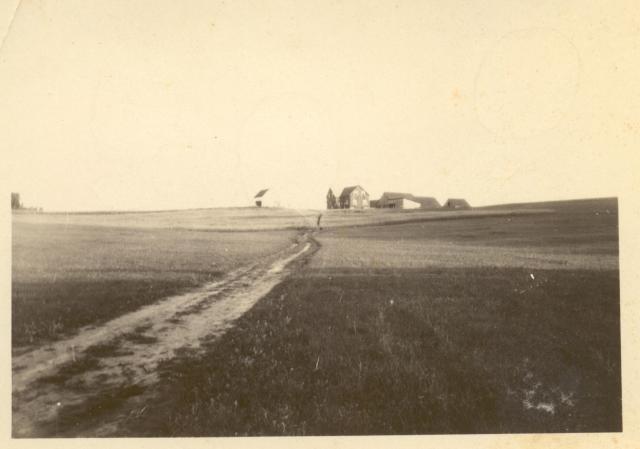 1930s:  Farm on hill.