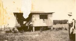 1940s:  The Martin shack. Bill Burge on porch, Wanda to the right.