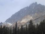 Band of light across craggy mountaintop, Icefields Parkway.