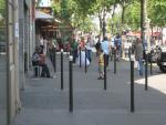 A sidewalk musician entertaining Justin with traditional French melodies.