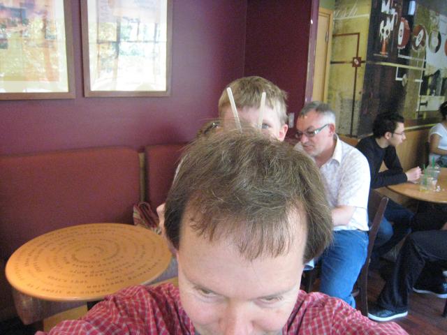 Randy and Emile clowing around.  A very hot day in a Parisian Starbucks.