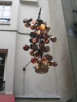 A copper-pot sculpture over a cafe, near Place Saint-Michel, Rive Gauche.