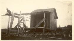 1935:  Martin shack being rebuilt on shore.