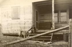 1940s:  New cabin with ice chest on porch.