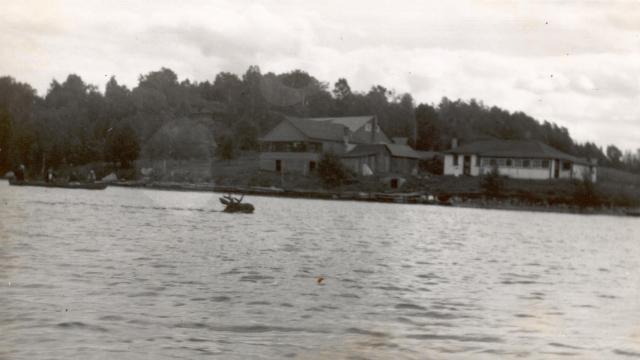 1950:  Moose crossing lake.