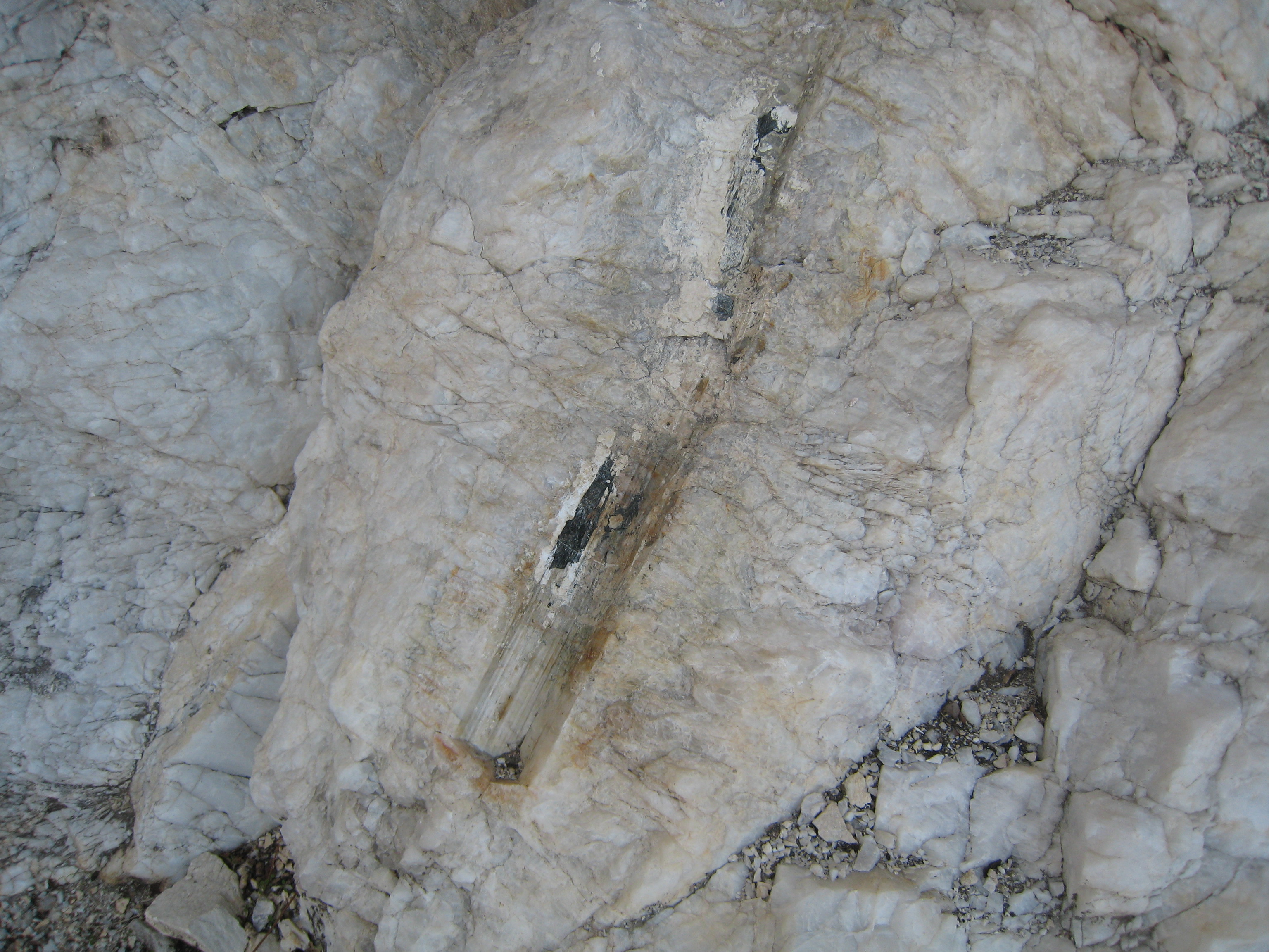 Tourmaline was here, about 2.5 feet long.  Tourmaline forms hexagonal crystals in quartz.