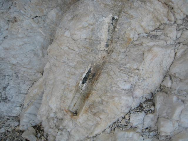 Tourmaline was here, about 2.5 feet long.  Tourmaline forms hexagonal crystals in quartz.